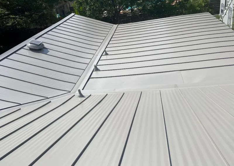 Solar attic fan installed on a metal roof for Roof Ventilation in National City
